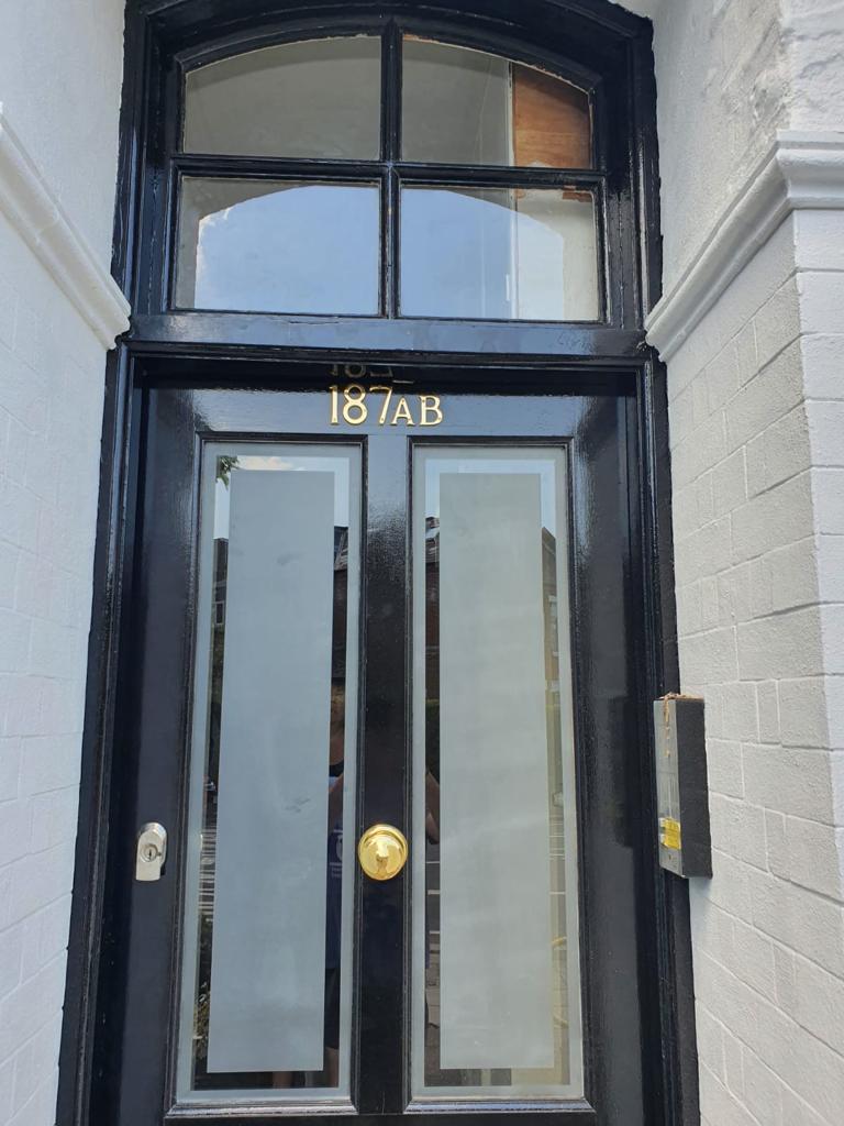 Satin glass re-glaze into a black-painted front door